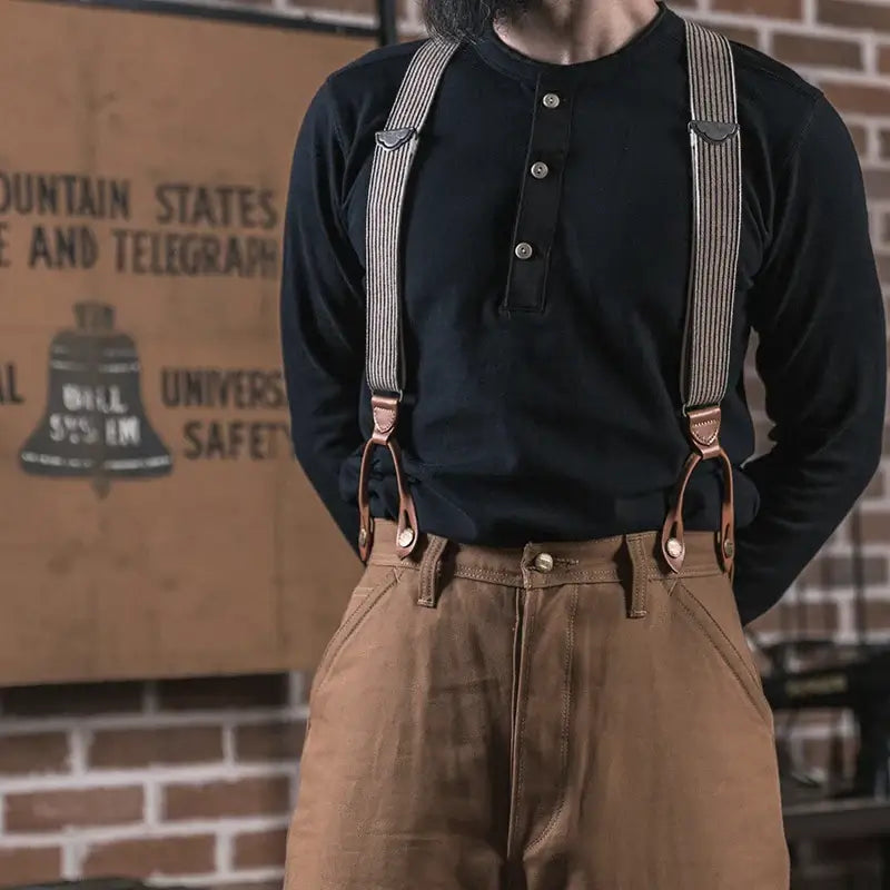Henley Cotton Organic Long Sleeve T-Shirt styled with suspenders, showcasing a vintage-inspired look and sustainable fashion.