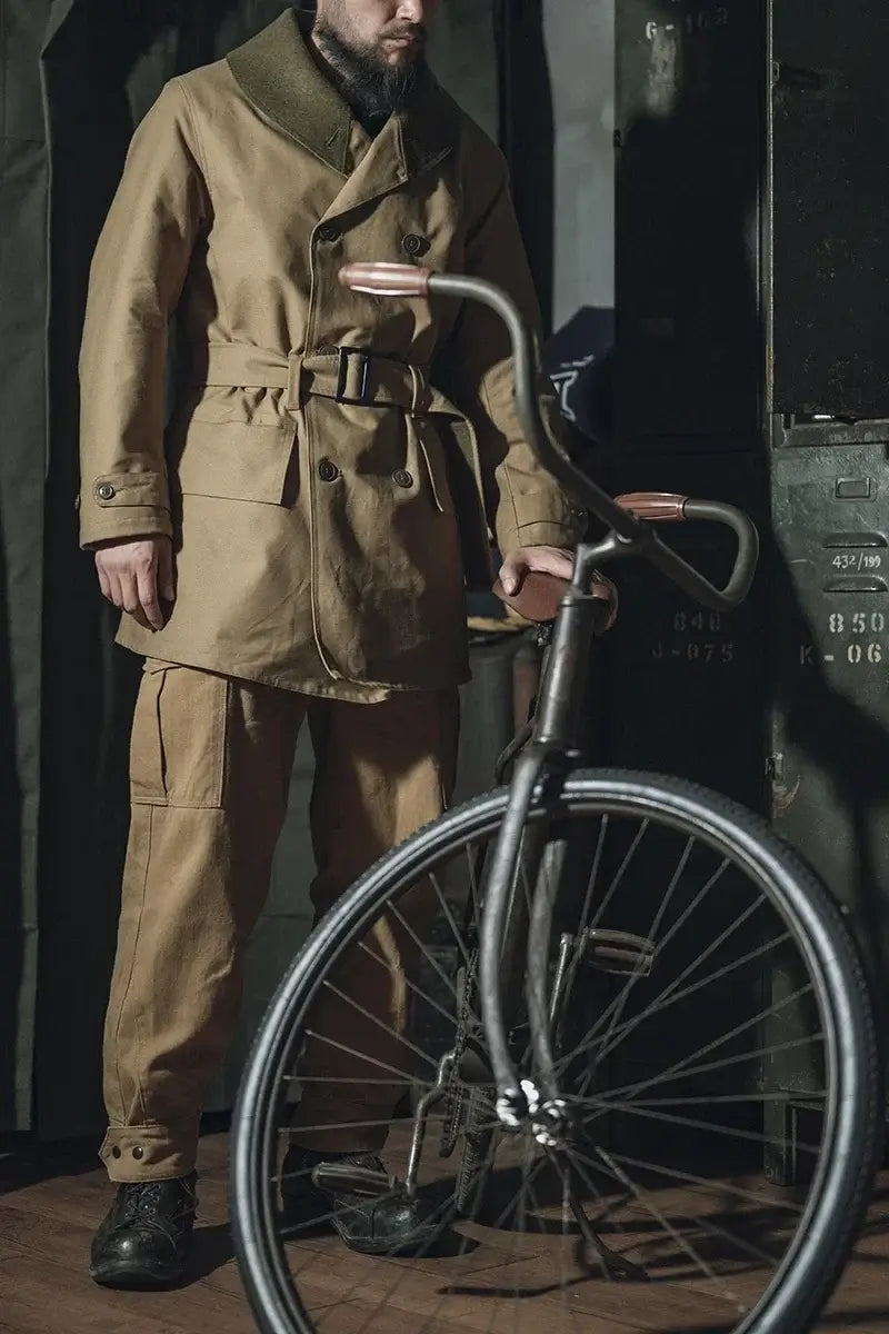 Rugged Bronson 1938 Mackinaw Coat with Woolen Lining Winter Heavy-Duty Men's Parka worn by a man next to a bicycle.