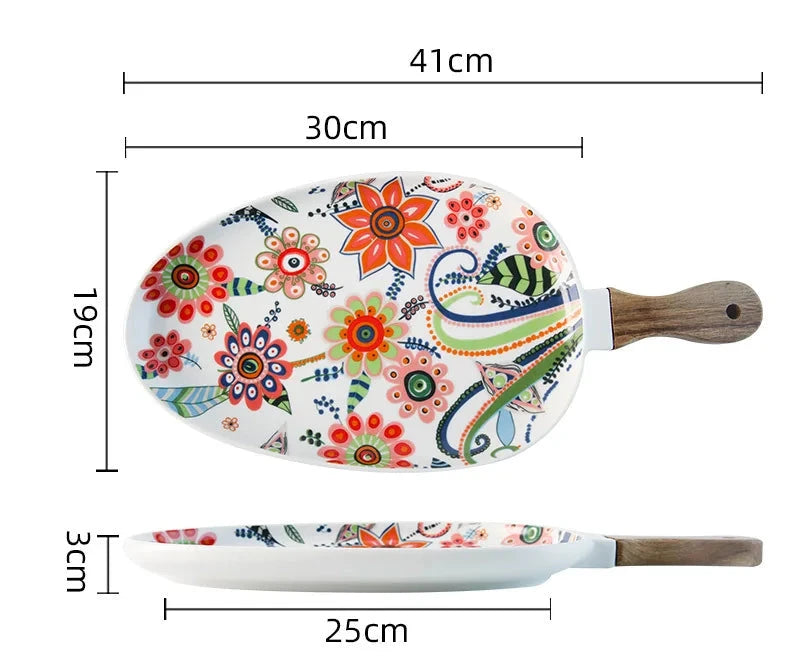 Colorful ceramic plate with floral design and wooden handle, shown with measurements on a white background.