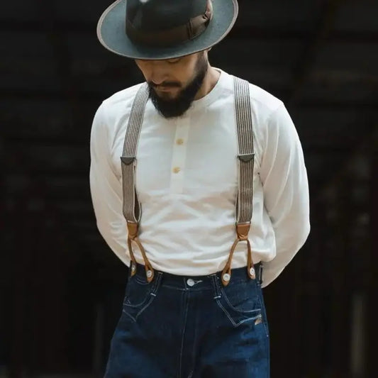 Henley Cotton Organic Long Sleeve T-Shirt worn with suspenders by a man, showcasing vintage style and sustainable fashion.