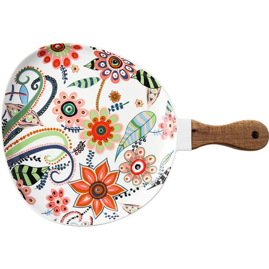 Decorative paddle with floral design on a white background